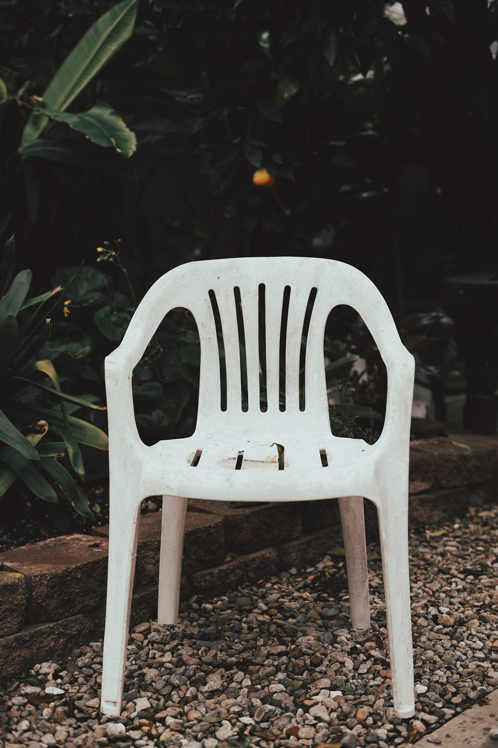 Monobloc Plastic Chair, a product of capitalism | Photo by Carter Baran on Unsplash